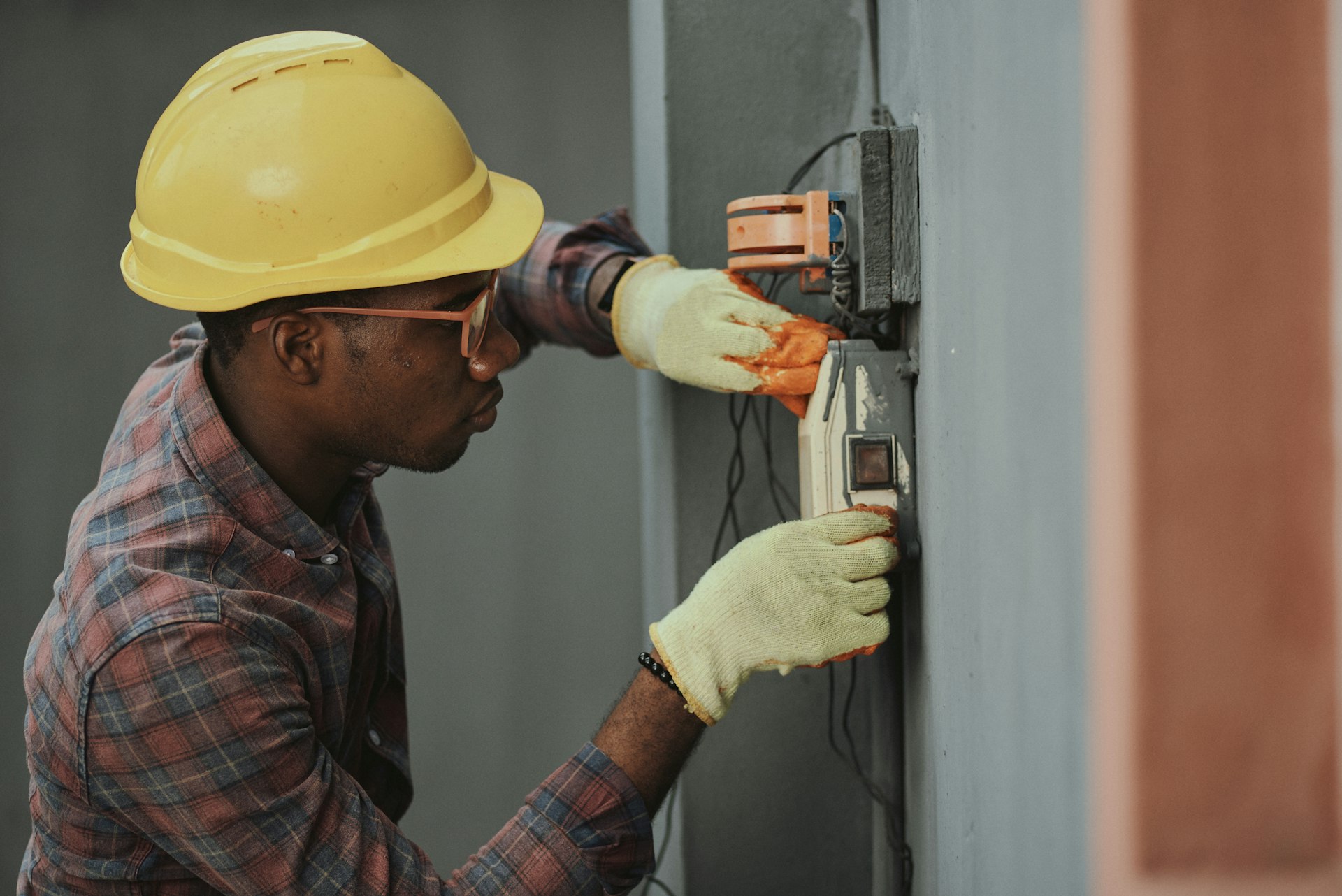 Professional electrician working on electrical installation